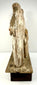 Rear view of wooden Santo figures revealing deep timber cracks and flaking paint layers