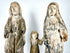 Frontal view of hand-carved wooden Holy Family trio with weathered white and grey finish