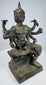 Opposite side view of the Thai devotional statue with raised ritual objects