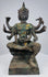Three-quarter view of the antique Thai bronze deity with ritual attributes