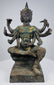 Three-quarter view of the antique Thai bronze deity with ritual attributes