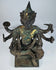 Close front view of the four-faced Brahma statue with surviving gold leaf