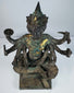 Close front view of the four-faced Brahma statue with surviving gold leaf