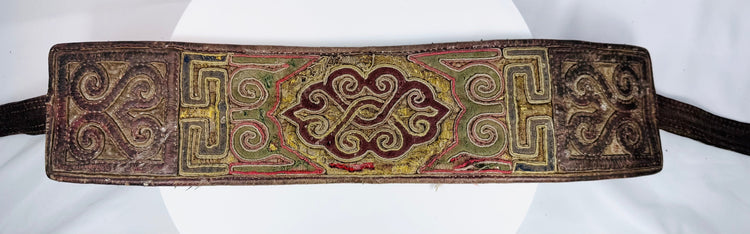 Front view of antique Tibetan textile belt with appliqué and embroidered geometric motifs