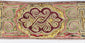 Close-up of Tibetan embroidered belt with colourful scroll and key-pattern decoration