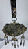 Authentic Himalayan ceremonial ornament featuring turquoise, coral, silvered copper alloy, and ornate repoussé craftsmanship.