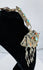 Antique Tibetan Buddhist gau amulet case displaying repoussé floral decoration and protective turquoise cabochons.