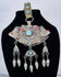 Historic Tibetan Buddhist portable shrine decorated with repoussé floral motifs and turquoise cabochons.