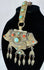 Traditional Tibetan portable shrine ornament with repoussé metalwork, turquoise, coral, and articulated hanging pendants.