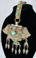 Traditional Tibetan portable shrine ornament with repoussé metalwork, turquoise, coral, and articulated hanging pendants.
