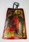 Front view of a 19th-century Tibetan Buddhist bone amulet with hand-painted polychrome details
