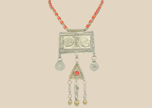 Antique Turkmen tribal necklace with a rectangular pectoral pendant, tumar amulet, and red glass beads.