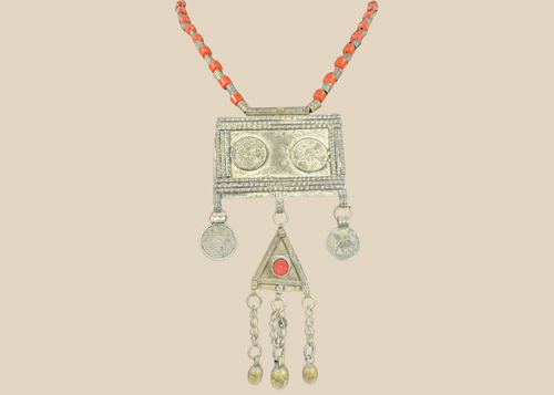 Antique Turkmen tribal necklace with a rectangular pectoral pendant, tumar amulet, and red glass beads.