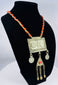 Antique Central Asian Turkmen pectoral necklace with suspended medallions, triangular amulet, and handcrafted decorative chains.