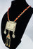 Traditional Turkmen necklace showcasing a large pectoral ornament, geometric decoration, and protective tumar amulet.