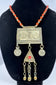 Central Asian Turkmen ceremonial necklace featuring silver-toned metal, coin pendants, and a triangular tumar pendant.