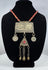 Antique Turkmen tribal jewelry with suspended coin elements, red glass beads, and handcrafted silver-toned metalwork.