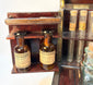 Close-up of Victorian apothecary bottles with paper labels and aged patina