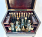 Detailed view of brass key and locking mechanism on antique medical cabinet