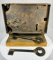 Forged iron door lock with large skeleton key and wooden mount