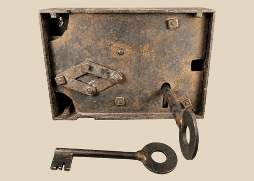 Antique 19th century iron rim lock with skeleton key on display
