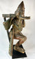 Antique Hindu Garuda statue — right-side profile on black pedestal.
