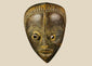 Antique Baule tribal mask from Ivory Coast, early 20th century, hand-carved wood with natural patina, oval face, almond-shaped eyes, and stylized features displayed on a stand.