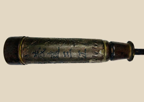 Antique Chinese temple candle holder from the Late Qing Dynasty (circa 1850–1911), cylindrical bronze form with engraved Chinese inscriptions and decorative motifs, mounted on a tapered base; patinated surface with signs of ritual use, once employed in Buddhist or Daoist temple settings as part of ceremonial altar furnishings.