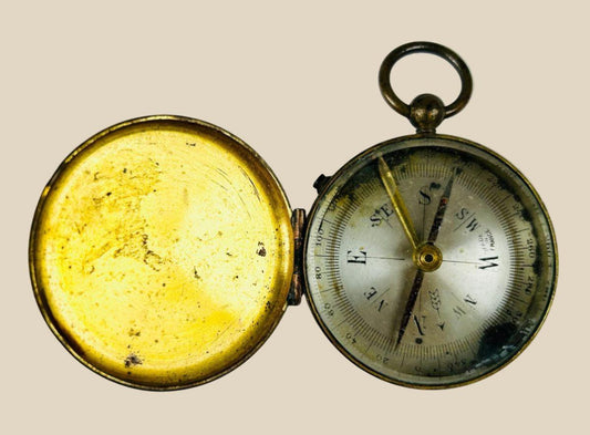 Antique French brass pocket compass with hinged lid, suspension loop, and azimuth scale, marked “Made in France,” circa 1880–1920.