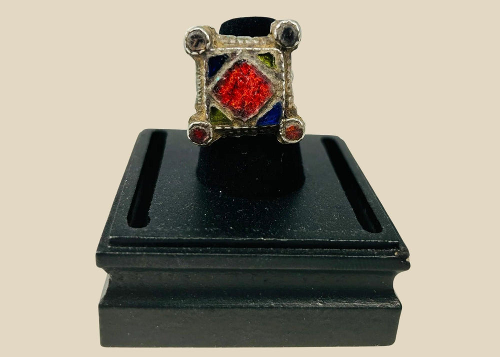 19th–early 20th century North African or Middle Eastern hand-forged silver ring with bold rectangular bezel, geometric incised motifs, thick shank, and rich patina, traditional tribal or Ottoman-influenced jewelry