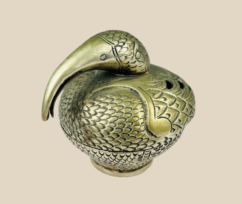 Antique South Indian Hindu ritual censer cast in bronze, crafted in the form of a stylized peacock with detailed plumage and long curved beak. Traditionally used in temple and household ceremonies for incense offerings, with natural aged patina.