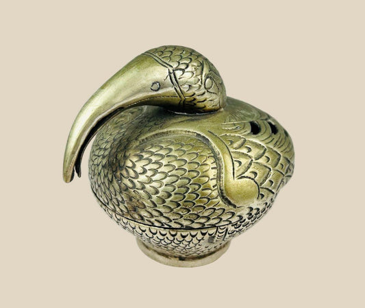 Antique South Indian Hindu ritual censer cast in bronze, crafted in the form of a stylized peacock with detailed plumage and long curved beak. Traditionally used in temple and household ceremonies for incense offerings, with natural aged patina.