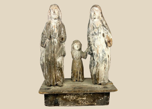 Antique Spanish Colonial Santo sculpture of the Holy Family, 19th century, hand-carved and painted wood figures depicting Joseph, Mary, and Child on a wooden base with aged patina.
