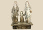 Antique Spanish Colonial Santo sculpture of the Holy Family, 19th century, hand-carved and painted wood figures depicting Joseph, Mary, and Child on a wooden base with aged patina.
