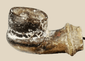 18th–19th century Middle Eastern or North African earthenware spout fragment, hand-formed with rounded bowl and narrow projecting stem, mineral encrustations, archaeological pottery piece