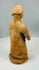 Folk-style terracotta sculpture with cap-like headdress