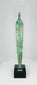 Close-up showing corrosion patterns and surface texture on a Near Eastern bronze blade