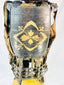 Gold-painted mon family crest on lacquered cuirass of authentic Muromachi Period samurai armor.