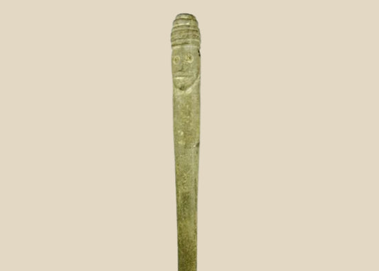 Ancient Bactrian dual-faced whetstone, 2nd millennium BCE, carved from chlorite or steatite with symmetrical features and natural patina.