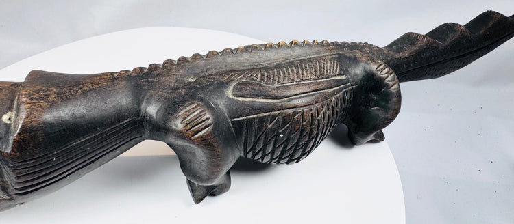 African wooden crocodile figure with incised patterns and raised dorsal ridge