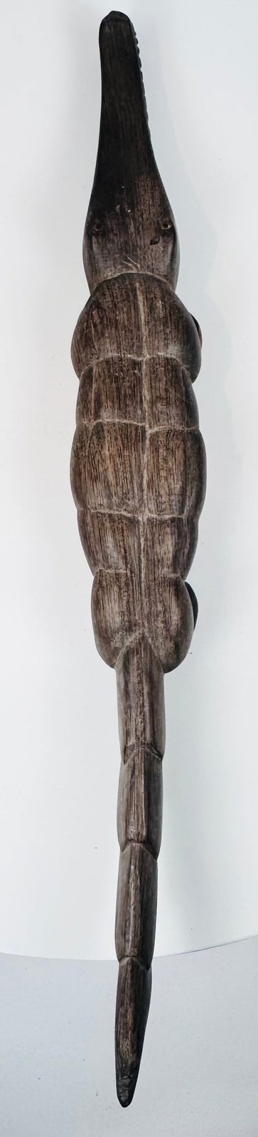 Hand-carved Mali crocodile figures showing traditional animal sculpture and surface wear