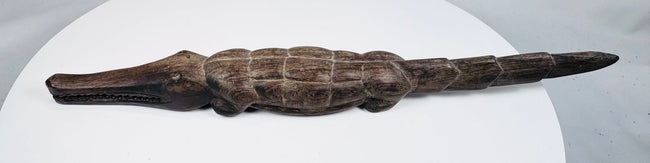 West African crocodile sculpture with dark patina and areas of exposed lighter wood