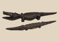 Pair of carved wooden crocodile figures attributed to Bamana and Bozo traditions of Mali