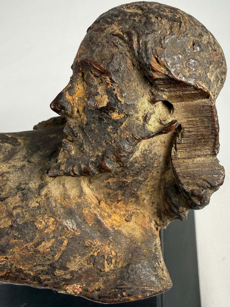 Carved wooden Christ figure from Spain or Italy with missing arms and historic surface wear