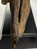 17th-century wooden Christ figure with expressive facial features and pronounced ribcage