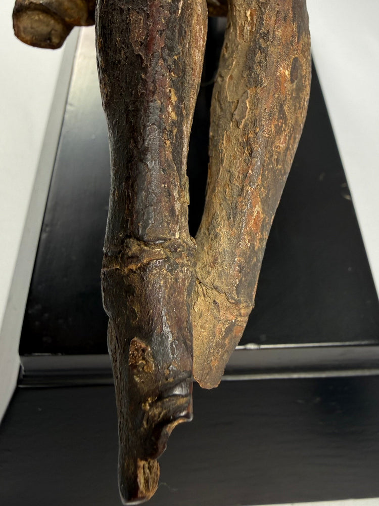 17th-century wooden Christ figure with expressive facial features and pronounced ribcage