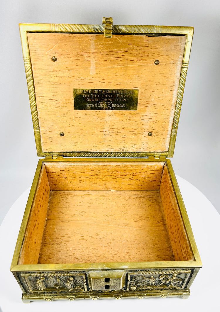 Decorative bronze box with courtly scenes and ornate Renaissance motifs