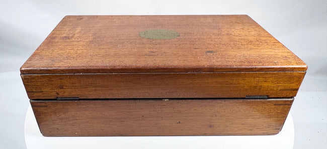 Antique wooden medical chest with hinged lid, keyhole and historic contents