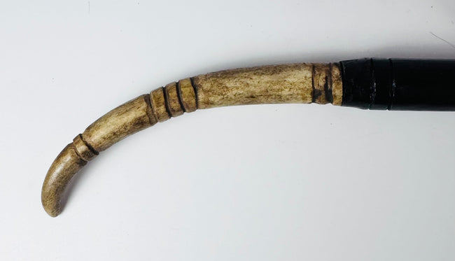 Detail of feather and hair ornaments attached to the Dayak sword hilt