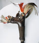 Kayan or Kenyah Mandau with woven fibre grip and red, black, and cream ornaments